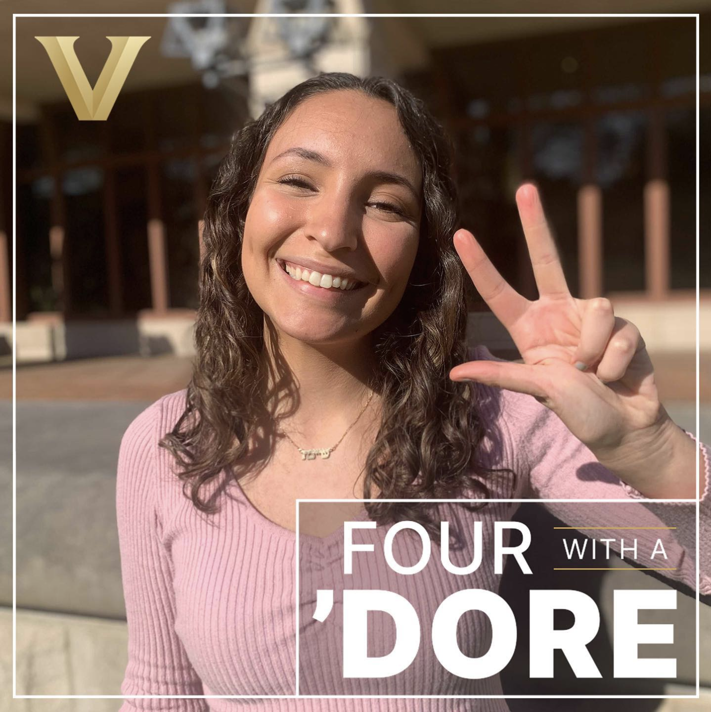 Student Jeanette Hurwitz showing the VU hand sign outside