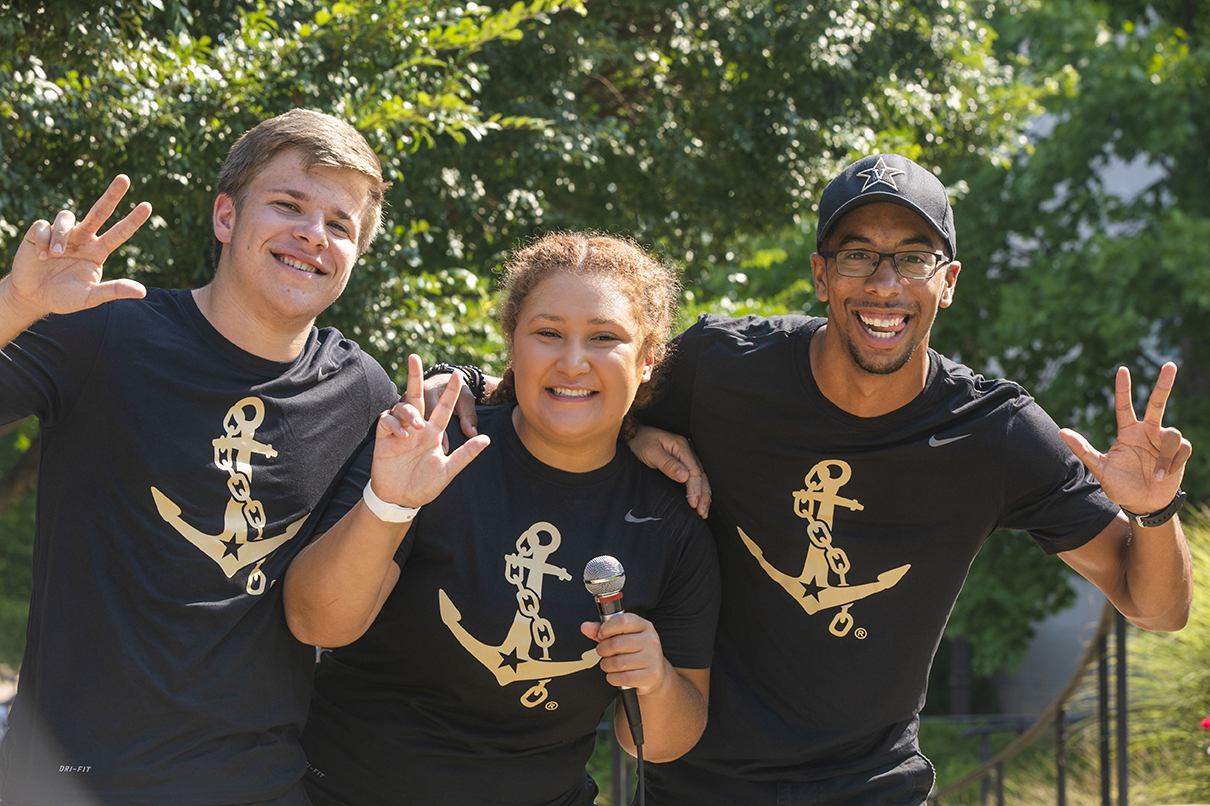 students showing the anchor down hand sign